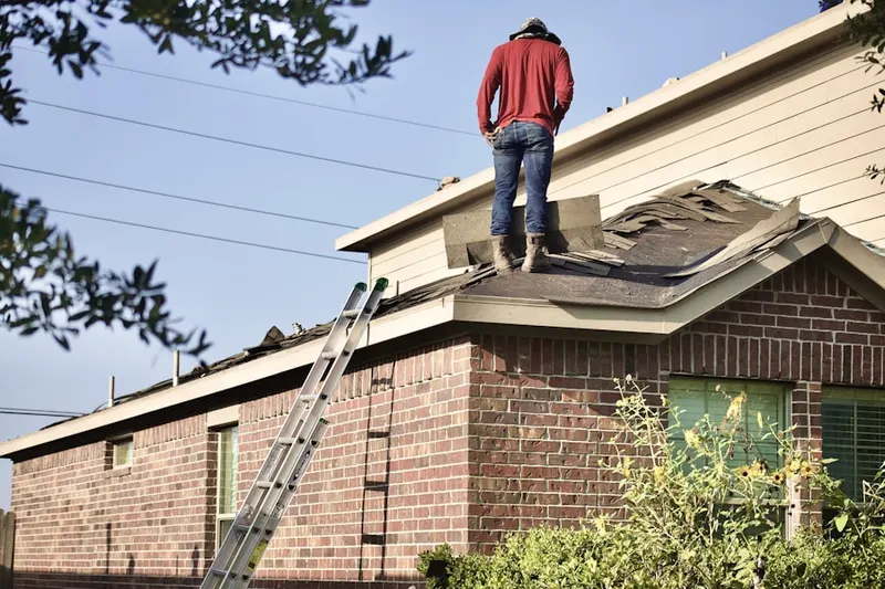 Professional roofer working on a residential roof in Fortuna